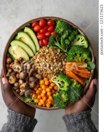 Nourishing Plant-Based Buddha Bowl with Ancient Grains and Seasonal Vegetables A Contemporary Wholesome Dining Experience Captured in Natural Light 123173625