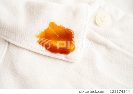 Dirty tomato sauce stain removal or ketchup on cloth accident to wash with washing powder, cleaning housework. 123174344
