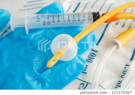 Foley catheter and urine drainage bag collect urine for disability or patient in hospital. 123174367