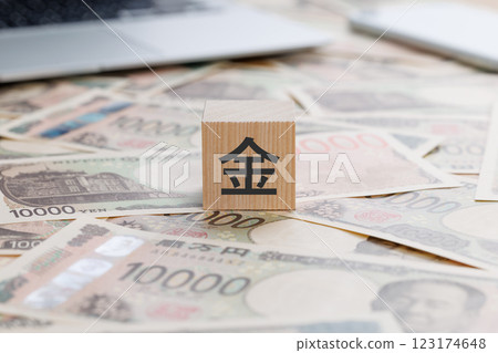 A block with the word "money" written on it A block with the word "money" written on it 123174648