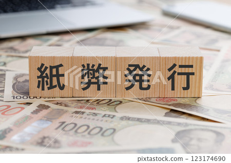 A block with the word "banknote issuance" written on it 123174690