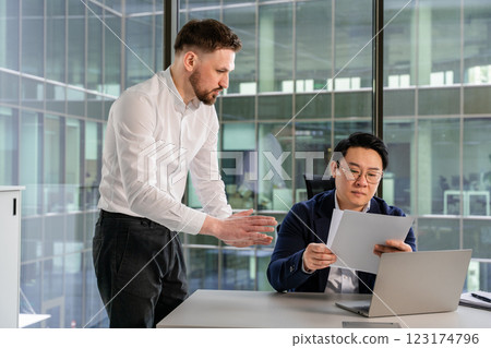 Professional Business Consultation Between Two Colleagues in a Modern Office Professional Business Consultation Between Two Colleagues in a Modern Office 123174796