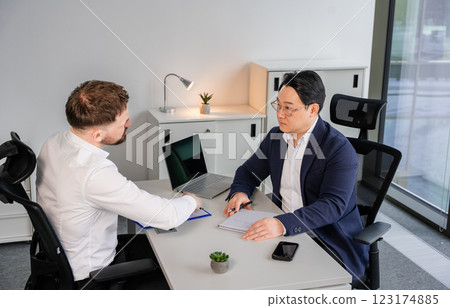 Professional Business Meeting Between Two Men in a Modern Office Setting 123174885