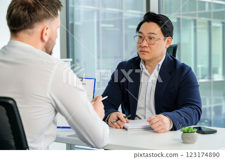 Professional Business Meeting in Modern Office with Confident Male Professionals 123174890