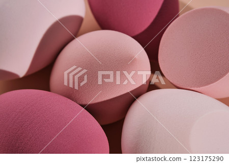 A set of makeup sponges on a pink background. 123175290
