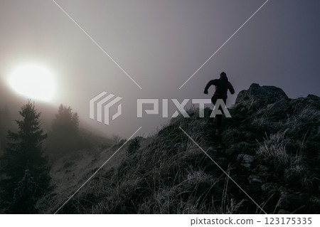 Trail Runner in Misty Mountain Landscape Trail Runner in Misty Mountain Landscape 123175335