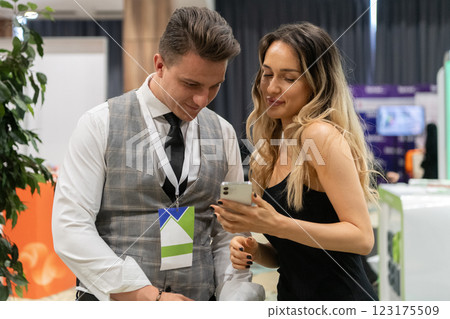 Professional Interaction at a Business Event Capturing Confidence and Engagement. Professional Interaction at a Business Event Capturing Confidence and Engagement. 123175509