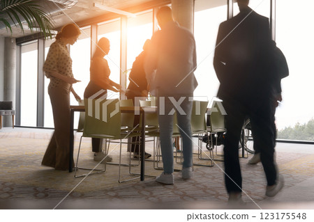 A diverse multiethnic business team engages in a collaborative meeting, discussing strategies and solutions in a modern office setting A diverse multiethnic business team engages in a collaborative meeting, discussing strategies and solutions in a modern office setting 123175548