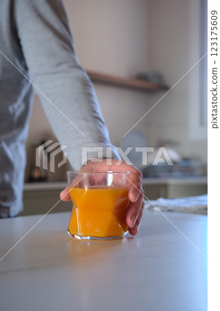 A glass of orange juice on the table A glass of orange juice on the table 123175609