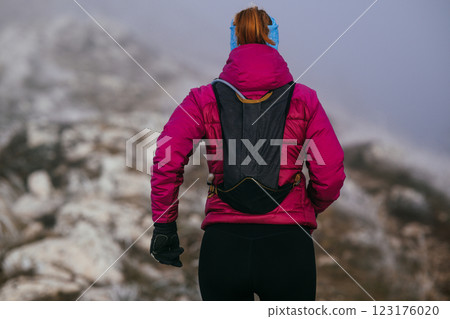 Trail Runner in Misty Mountain Landscape 123176020