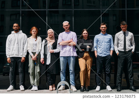 A diverse and confident group of businessmen posing together, radiating success, ambition, and unity, capturing the essence of a dynamic and inspiring business environment 123176075