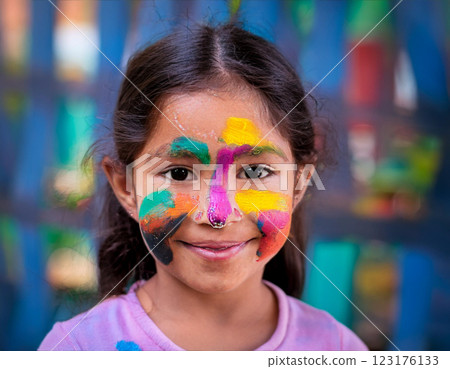 Happy Little Girl with Multicolored Face Paint 123176133