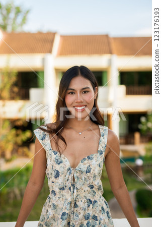 Young woman smiling face outdoors during summer 123176193