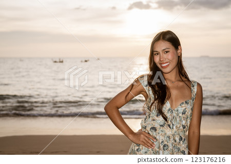 Portrait of young woman on the beach Portrait of young woman on the beach 123176216