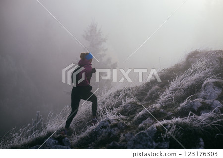 Trail Runner in Misty Mountain Landscape 123176303