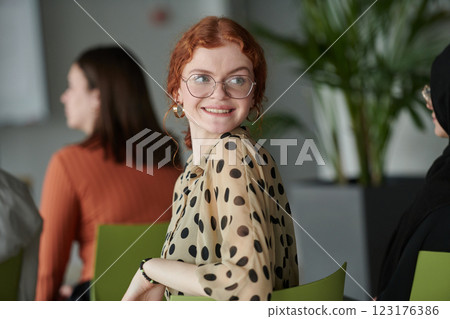 A diverse multiethnic business team engages in a collaborative meeting, discussing strategies and solutions in a modern office setting A diverse multiethnic business team engages in a collaborative meeting, discussing strategies and solutions in a modern office setting 123176386