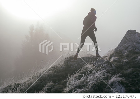 Trail Runner in Misty Mountain Landscape 123176473