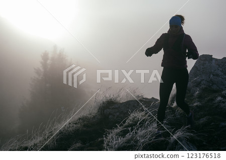 Trail Runner in Misty Mountain Landscape Trail Runner in Misty Mountain Landscape 123176518