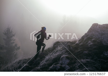 Trail Runner in Misty Mountain Landscape Trail Runner in Misty Mountain Landscape 123176637