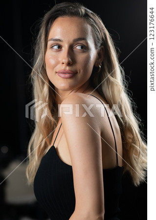 Radiant Elegance: A Stunning Blonde in a Black Dress Exuding Confidence and Beauty. Radiant Elegance: A Stunning Blonde in a Black Dress Exuding Confidence and Beauty. 123176644