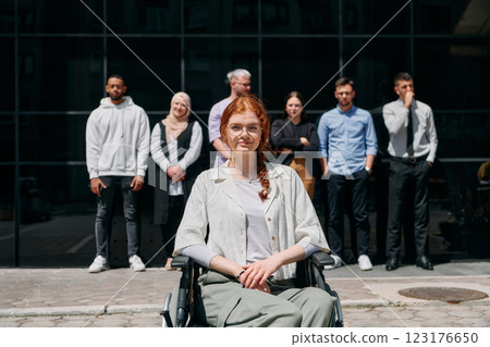 A diverse and confident group of businessmen posing together, with a businesswoman in a wheelchair radiating success, ambition, and unity, capturing the essence of a dynamic and inspiring business A diverse and confident group of businessmen posing together, with a businesswoman in a wheelchair radiating success, ambition, and unity, capturing the essence of a dynamic and inspiring business 123176650
