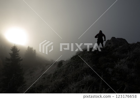 Trail Runner in Misty Mountain Landscape Trail Runner in Misty Mountain Landscape 123176658