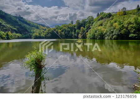 Sera Golu lake (Trabzon lake) in Trabzon, Turkey daylight view with mountains and clouds in the sky in background Sera Golu lake (Trabzon lake) in Trabzon, Turkey daylight view with mountains and clouds in the sky in background 123176856
