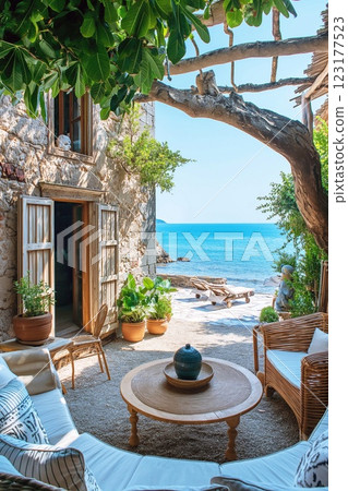 View of the terrace of a cozy hotel in boho style, overlooking the sea, summer vacation concept. 123177523