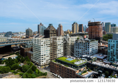 View of vibrant city Brooklyn skyline with mix of modern, historic buildings, greenery at NYC View of vibrant city Brooklyn skyline with mix of modern, historic buildings, greenery at NYC 123178030