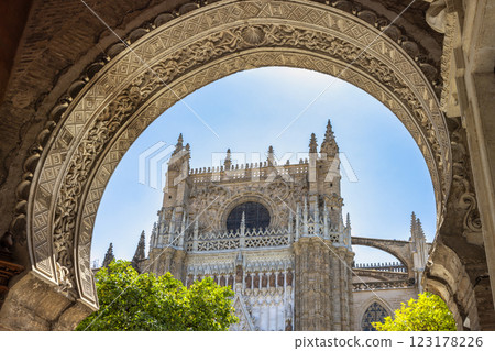 Seville Cathedral, The Cathedral of Saint Mary of the See in Seville town, Andalusia, Spain, Europe. Gothic cathedral viewed through ornate archway. 123178226