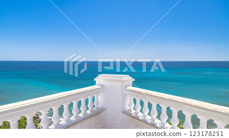 Nerja town, a resort of The Costa del Sol seaside region in Andalusia in the south of Spain. Serene ocean view from a white balustrade. Enjoy the breathtaking turquoise water and clear blue sky. 123178251