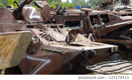 Rusty and burned-out armored vehicles on ukrainian territory. Exhibition of destroyed military equipment of the russian army. War between Ukraine and russia. Close up Slow motion 123178413