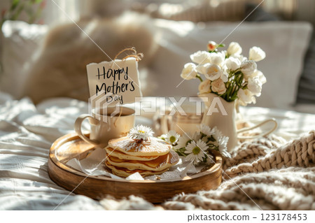 Mothers Day breakfast in bed with pancakes and flowers 123178453