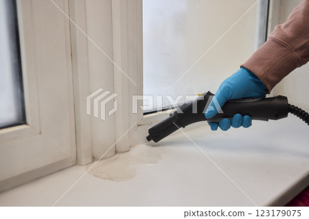 Efficient Steam Cleaning of Windows Utilizing Specialized Professional Equipment and Tools Efficient Steam Cleaning of Windows Utilizing Specialized Professional Equipment and Tools 123179075