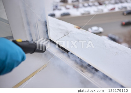 Efficient Steam Cleaning of Windows Utilizing Specialized Professional Equipment and Tools Efficient Steam Cleaning of Windows Utilizing Specialized Professional Equipment and Tools 123179110