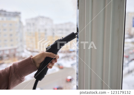 Efficient Steam Cleaning of Windows Utilizing Specialized Professional Equipment and Tools Efficient Steam Cleaning of Windows Utilizing Specialized Professional Equipment and Tools 123179132