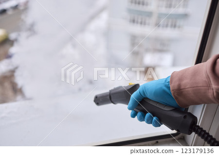 Efficient Steam Cleaning of Windows Utilizing Specialized Professional Equipment and Tools Efficient Steam Cleaning of Windows Utilizing Specialized Professional Equipment and Tools 123179136