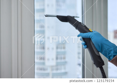 Winter Window Cleaning performed with a Squeegee for optimal results and clarity 123179154