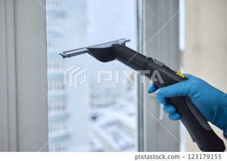 Winter Window Cleaning performed with a Squeegee for optimal results and clarity 123179155