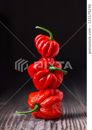 Three ripened red habanero peppers 123179298