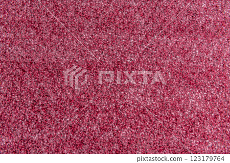 Close up of pink homemade knitted fabric with large stitches. Textured background 123179764