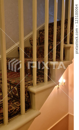Cozy vintage white stairs in small house 123180064