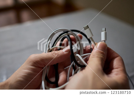 Tangled Cords in Hand The Everyday Clutter and Chaos of Our Modern Technology Life 123180710