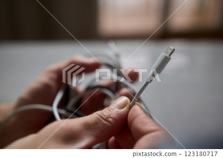 Tangled Cords in Hand The Everyday Clutter and Chaos of Our Modern Technology Life 123180717