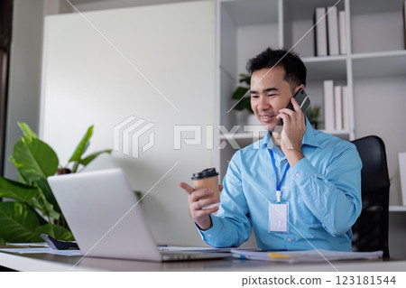 Business professional engaging in conference call modern office digital communication indoor setting focused perspective productivity concept 123181544