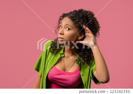 Curious African Woman Doesn't Hear, Asking What. Quiet Sound, Deaf,Misunderstand Curious African Woman Doesn't Hear, Asking What. Quiet Sound, Deaf,Misunderstand 123182350