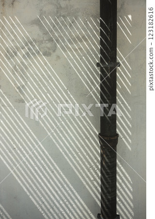 Diagonal light shining through pipes and walls Diagonal light shining through pipes and walls 123182616