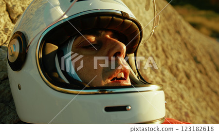 Astronaut Resting On A Rock Suffering From Lack Of Supplies To Live Astronaut Resting On A Rock Suffering From Lack Of Supplies To Live 123182618