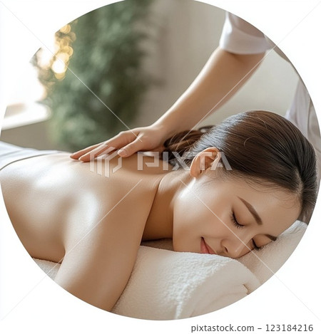A woman is soothed by a massage at a beauty salon 123184216