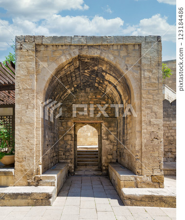 Exploring the historic architecture in the Courtyard of the Palace of the Shirvanshahs in Baku Azerbaijan Exploring the historic architecture in the Courtyard of the Palace of the Shirvanshahs in Baku Azerbaijan 123184486
